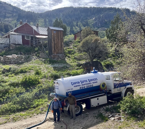 Canyon Septic Services — service scene with foothills behind, Caldwell, Idaho