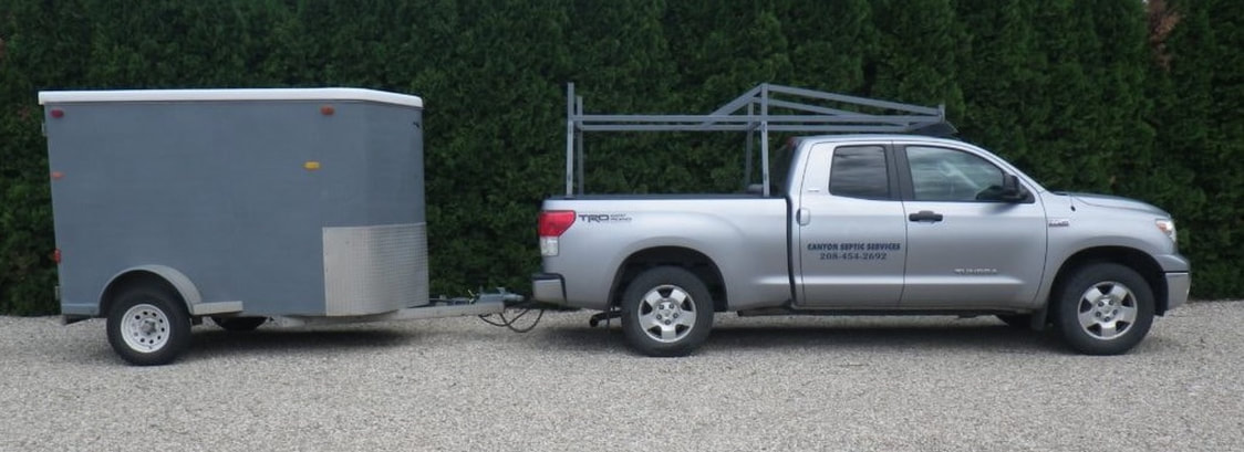 The pickup and trailer used by Canyon Septic Services — Caldwell, Idaho